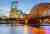 Illuminated Cologne cathedral and bridge over the river during the evening | Cologne, Germany