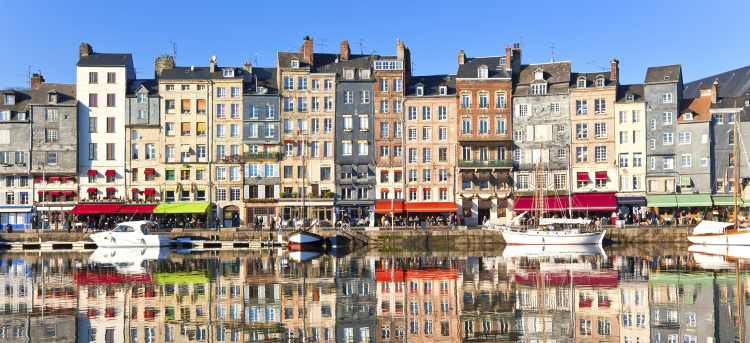 Sunny View of Colourful Houses Along Honfleur's Harbour | Riviera Travel
