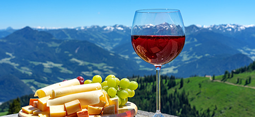 Cheese and wine with Alps in the background