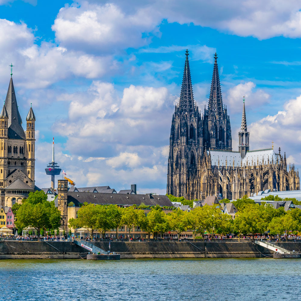 Cityscape of Cologne with Hohenzollern bridge, cathedral and Saint Martin church, Germany