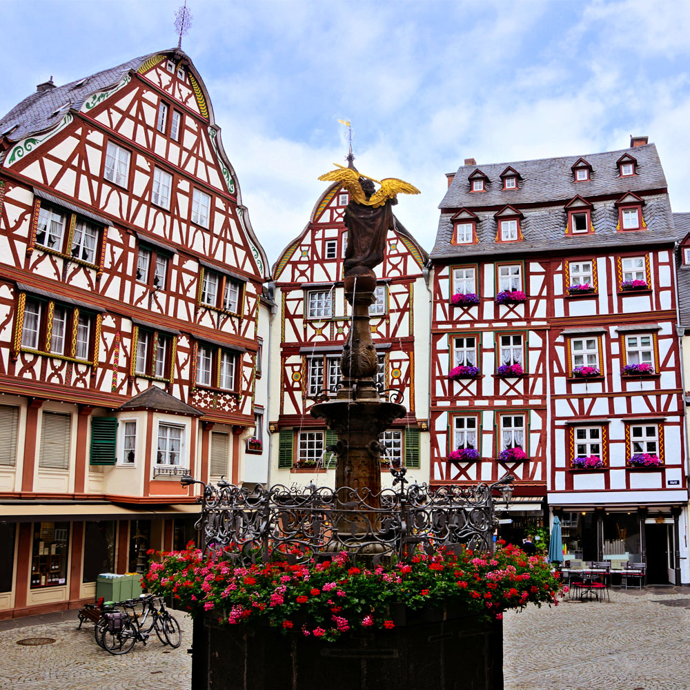 Market Square with fountain and half timbered buildings in Bernkastel, Germany