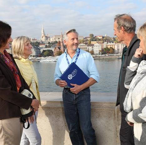 Tour manager guiding a small group in Budapest